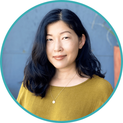 Photo of Dr. Shianling Weeks, clinical supervisor for Stella Nova therapists in San Francisco, CA. Shianling is an Asian American woman with wavy black hair. She is wearing a green sweater and a silver necklace.