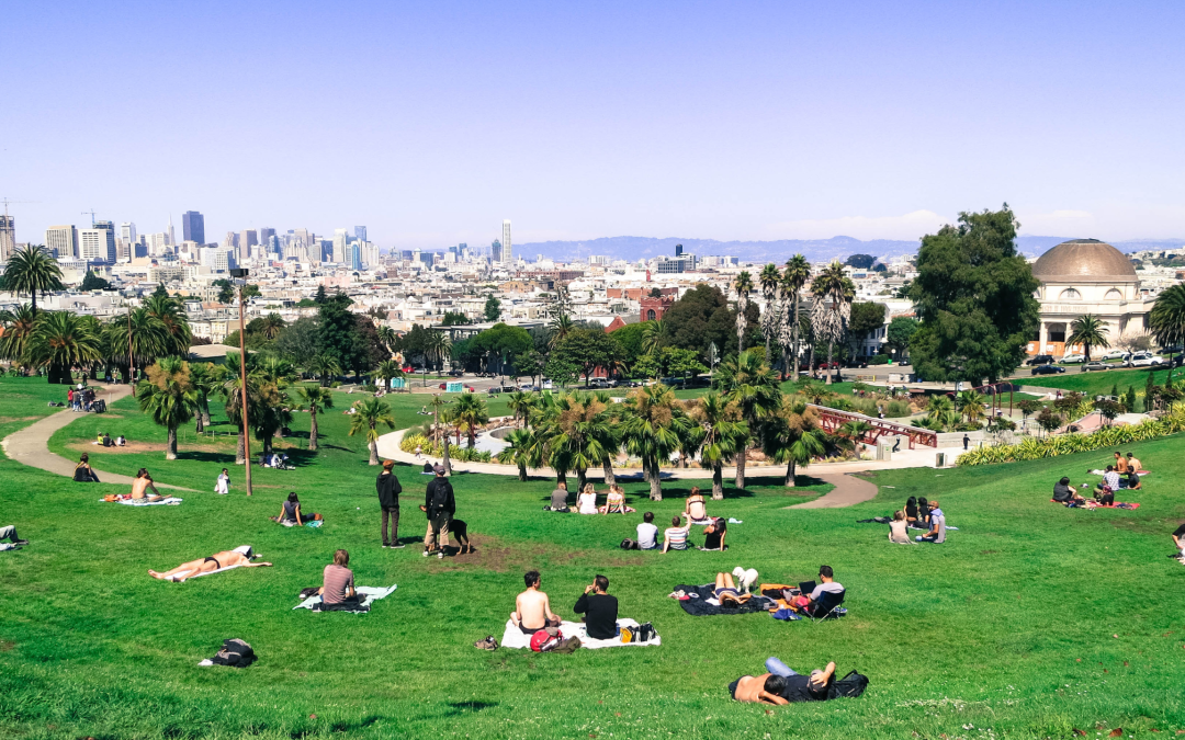 People relaxing at San Francisco's Dolores Park on a sunny day.